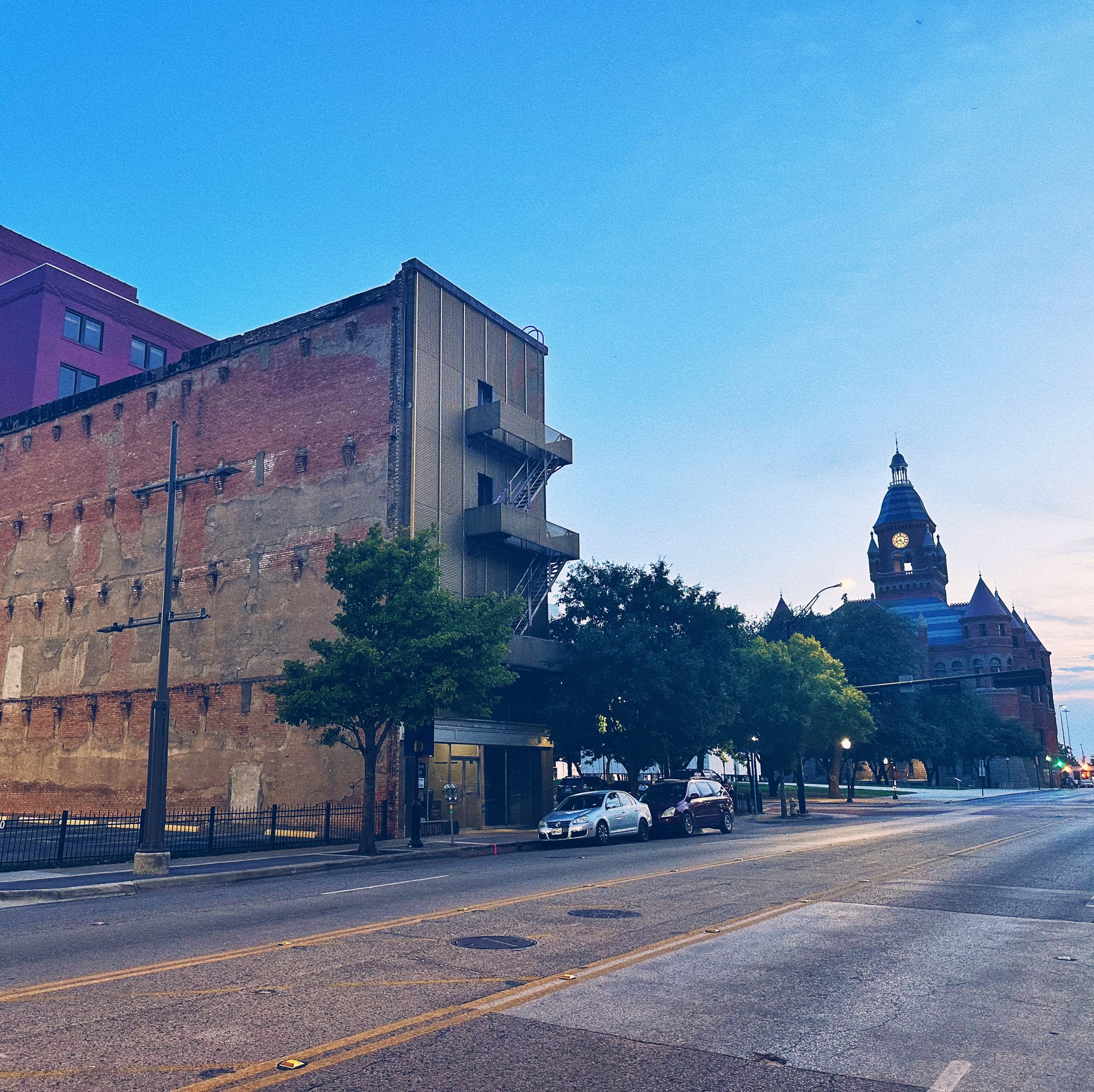 A view of Main St in Downtown Dallas, TX at sunset in August, 2023.